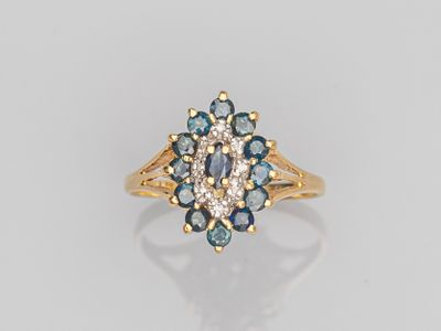 a gold ring with blue and white diamonds