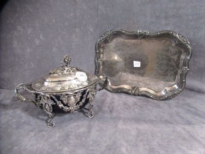 two silverplated dishes and a tray on a gray cloth