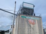 a cement building with a sign on the side of it