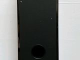 an image of a black speaker sitting on top of a table
