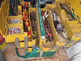 a yellow tool box with tools in it on the floor