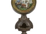 une horloge sur laquelle figurent les portraits d'un homme et d'une femme