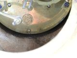 a close up of a clock on a table
