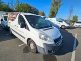 a white van that is parked in a parking lot