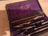 five different types of surgical instruments in a purple case