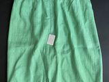 a green skirt with a tag on it