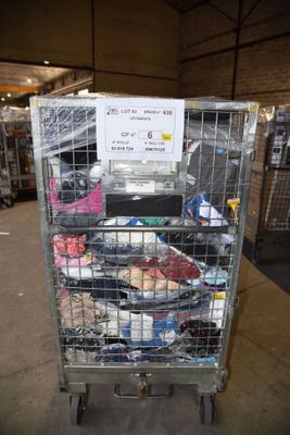 a metal cart with a lot of shoes in it