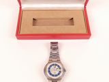 an image of a wrist watch in a red box on a white surface