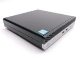 an image of a small black computer sitting on top of a white surface