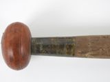 a close up of a baseball bat with a wooden handle