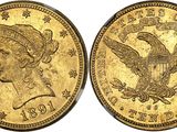 a gold coin with an eagle on it and a woman ' s head