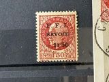 several stamps are on display in a glass case on a table
