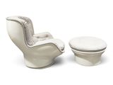 a white chair and ottoman sitting next to each other
