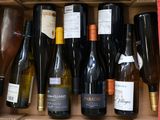 many bottles of wine in a box on the table