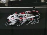 a picture of a race car with autographs on it