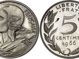 a close up of a coin with a woman ' s face on it