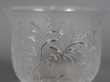 a close up of a glass vase on a table
