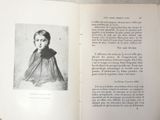 an open book with a picture of a woman on it