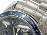 a close up of a watch with a blue face