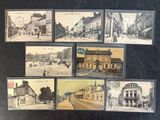 several old postcards of old buildings and people walking on the street
