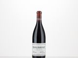 a bottle of red wine sitting on top of a table