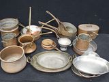 many pots and pans that are on a table