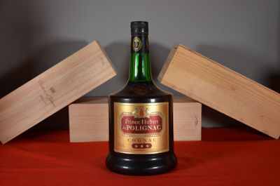 a bottle of alcohol sitting on a table with wooden blocks