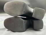 a close up of a pair of shoes that are on a table