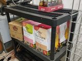 a metal shelf with boxes on it in a kitchen