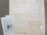 quatre pages de dessins et un livre posés sur une table