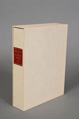 an image of a white book with a red label sitting on a table