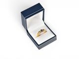 an image of a ring in a black box on a white background