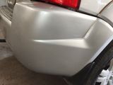 a close up of a car ' s bumper with a red light on