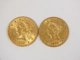 two gold coins, one of which is a woman and one of which is a man