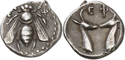 a silver coin with an image of a man and a woman on it