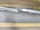 a large knife that is laying on top of a box