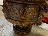 a large wooden bowl sitting on top of a marble floor