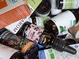a pile of bottles of various types of skin care products