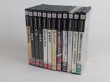 a lot of dvds that are stacked on top of each other