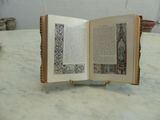 an open book sitting on a marble table