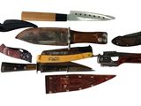 many different types of knives on a white background