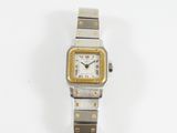 une image représentant une montre en or et en argent sur fond blanc