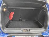 a trunk of a car with a red bag in it