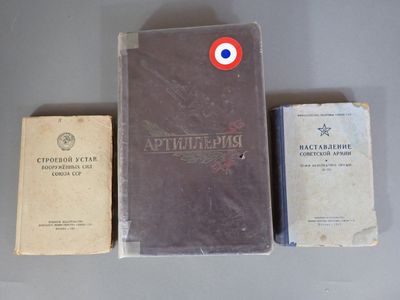 three books sitting on top of a table next to each other