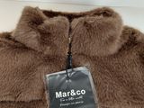 a close up of a brown jacket with a tag on it