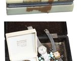 a box with a watch and other items in it