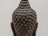 a close up of a statue of a person on a table