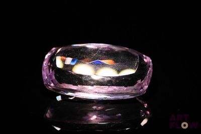 a purple ring with a picture of a cat inside of it