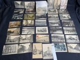 many old postcards on a table with a black background