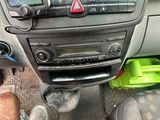 a close up of the dashboard of a car with a cat on it